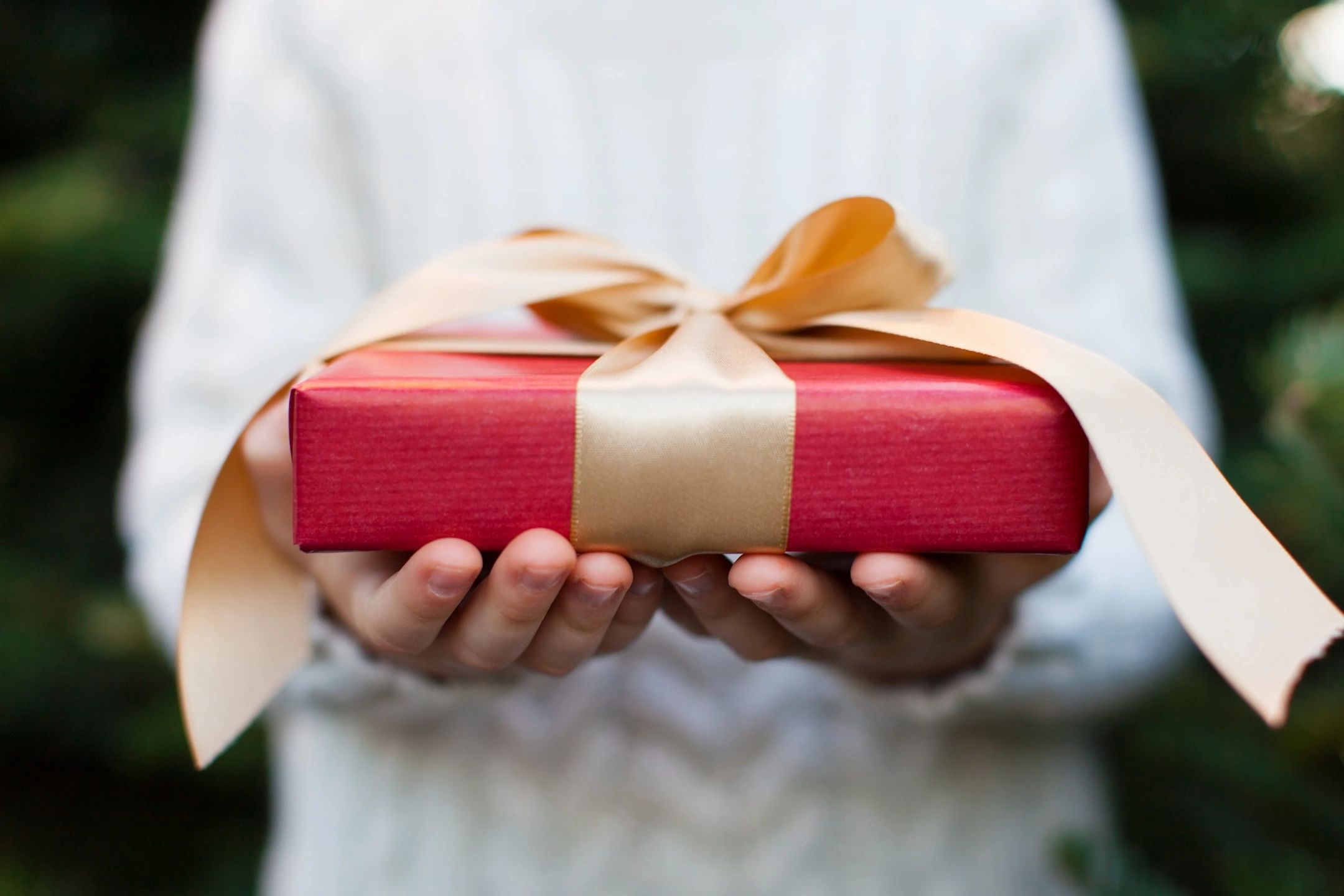 Red gift box with cream ribbon