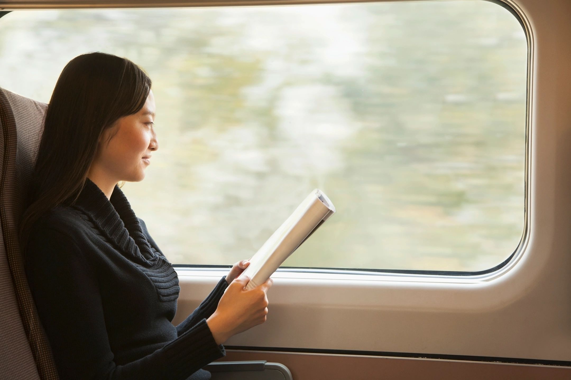 Woman reading on a train